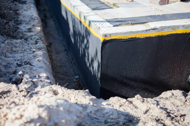 Professional Waterproofing technician working in Carteret, NJ